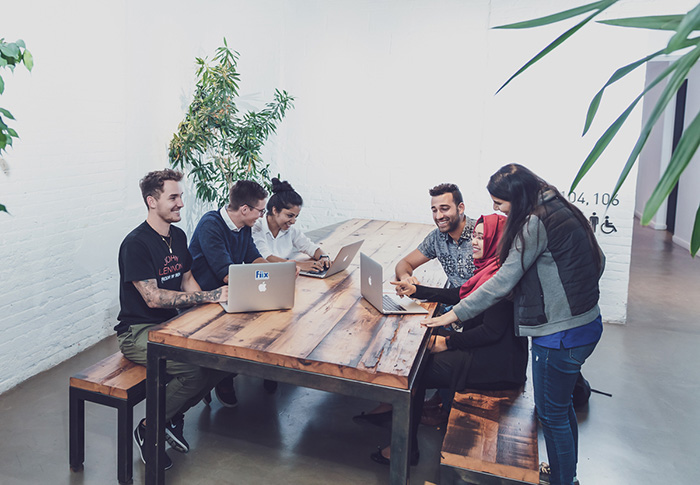 6 Fiixers working together in a meeting room