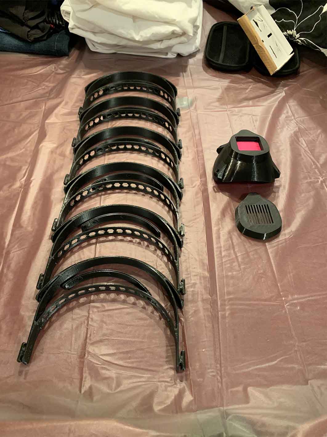 Picture of of the pieces of the protective masks made by Brandon using his 3D printer